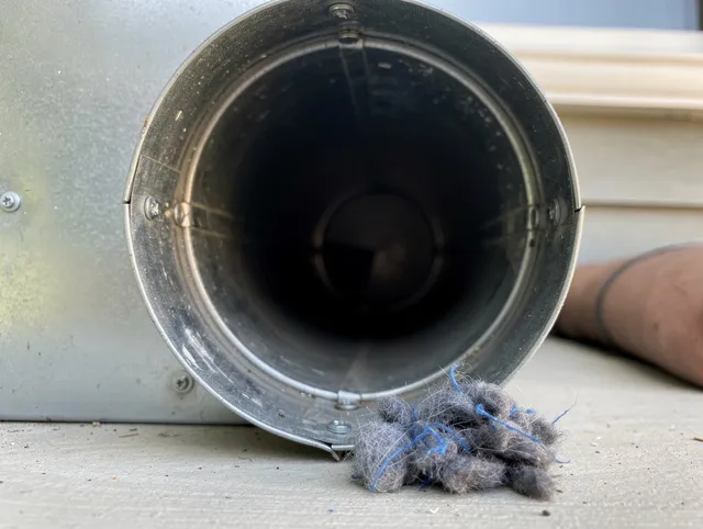 Fairview Park Dryer Vent Cleaning technician using specialized equipment to clear severe dryer vent blockage in Fairview Park